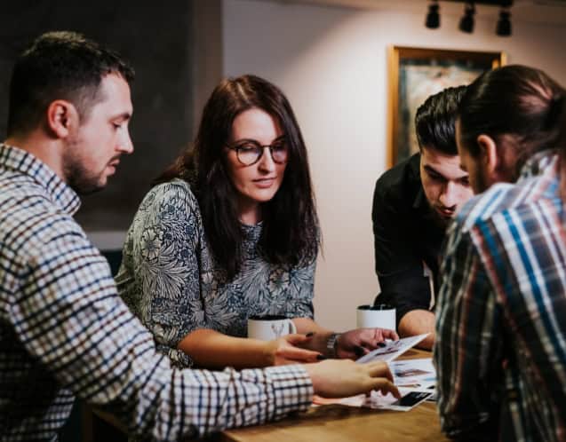 devsecops team members working at a table